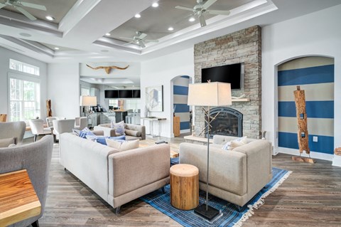 a living room filled with furniture and a fire place